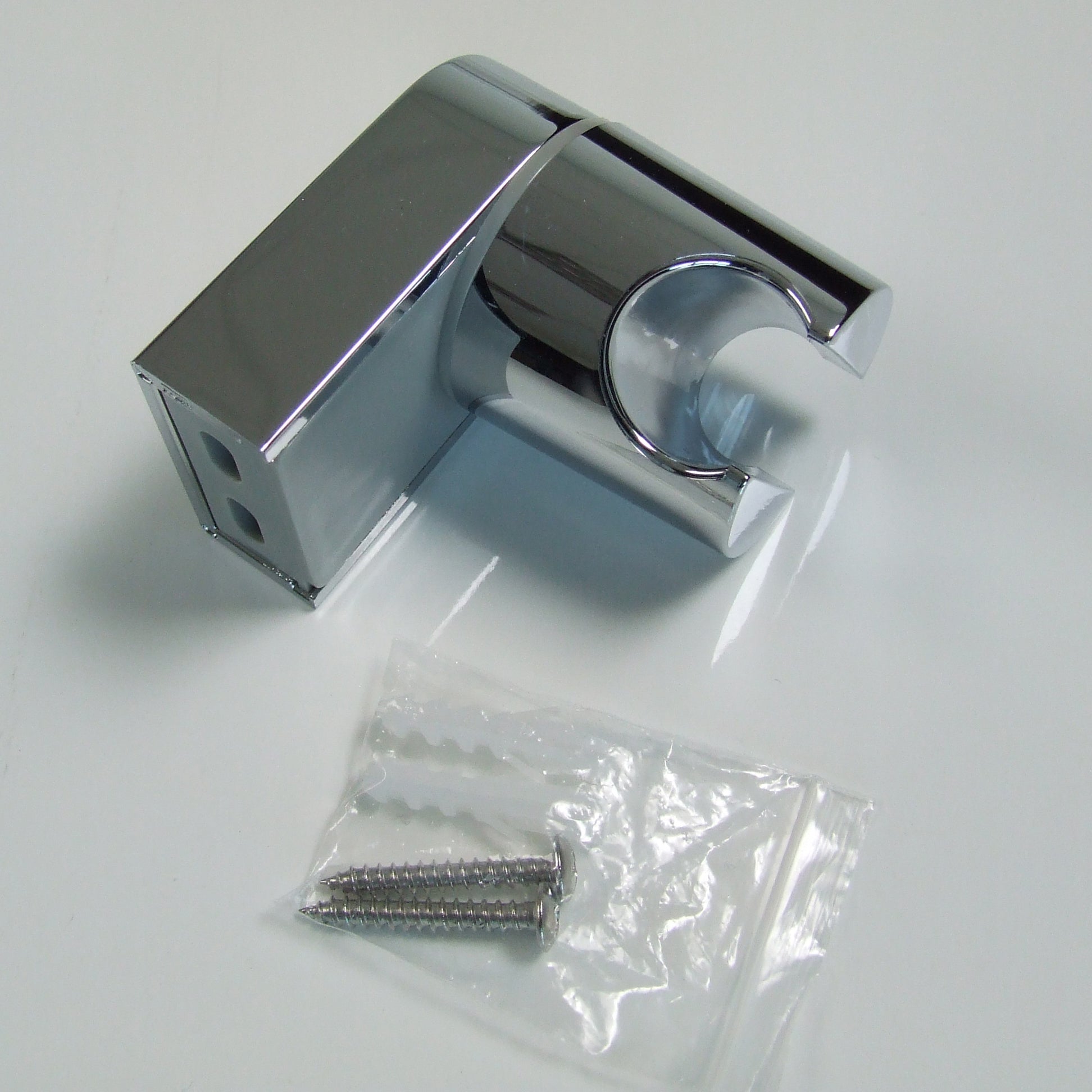 Wall bracket for hand-held shower heads